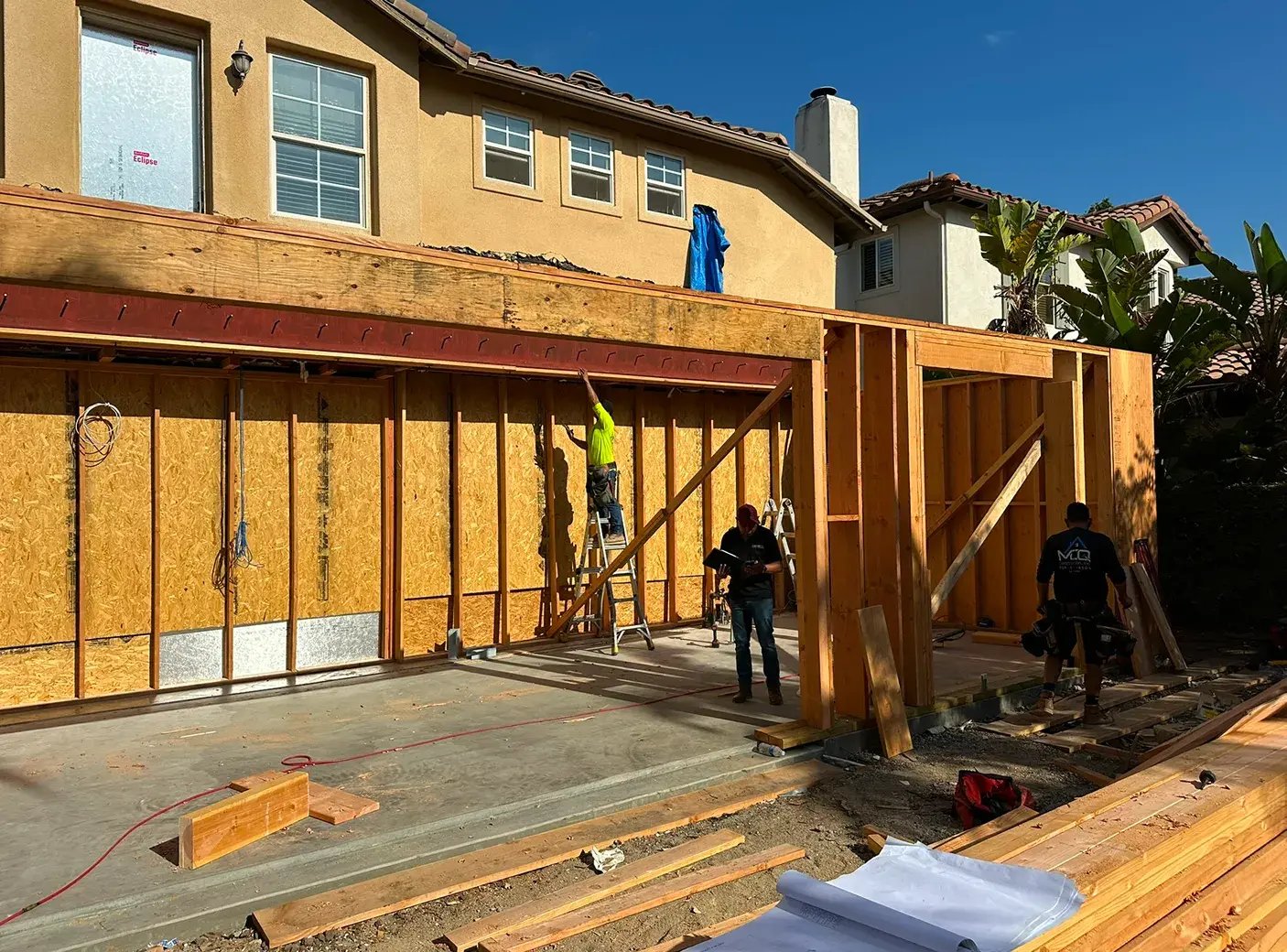 two-people-working-outside-construction